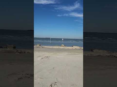 East Beach Galveston Tx watching the ships float by bring in the tariff goods enjoy the sand & sea