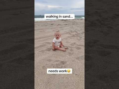 poor girl fighting for her life in the sand😂 #baby #milestone #downsyndrome