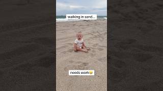 poor girl fighting for her life in the sand😂 #baby #milestone #downsyndrome