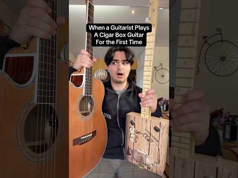 When a guitarists plays a cigar box guitar for the first time