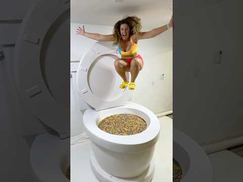 GOING UNDER and JUMPING HIGH in the Worlds Largest Toilet Filled with FROOT LOOPS #shorts