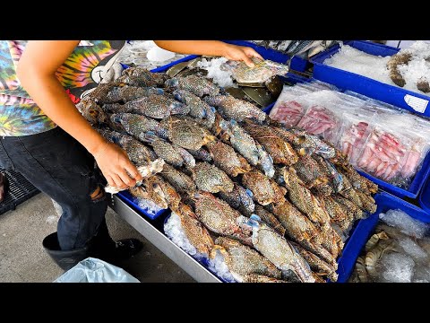 Chili crab and grilled freshwater shrimp made by a fishmonger - Thai street food