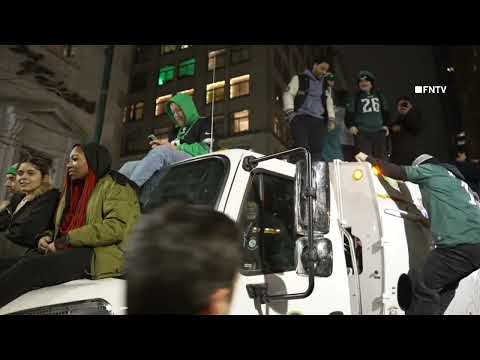 Eagles Fans climb EVERYTHING in Philadelphia as Thousands Celebrate Superbowl