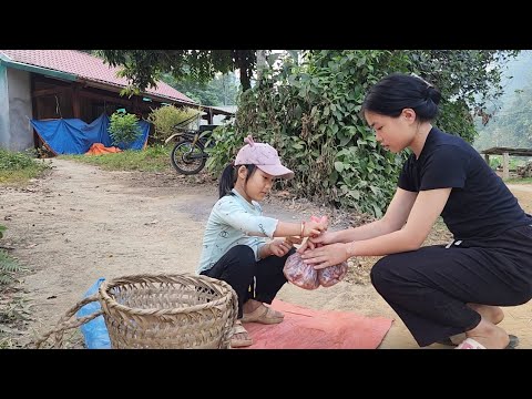 The girl, went to harvest peanuts, then boiled them, she brought them out to sell on the sidewalk.