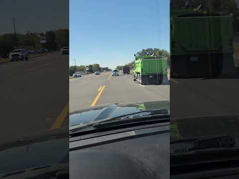 Massive amount of Dump Trucks on the road at one time, digging a lake near by Heavy Dump trucks