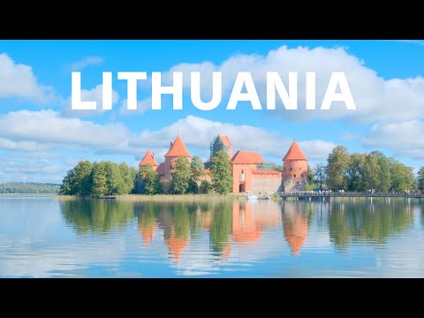 Trakai Island Castle, an old orange castle floating on the shore of a lake in Lithuania🇱🇹