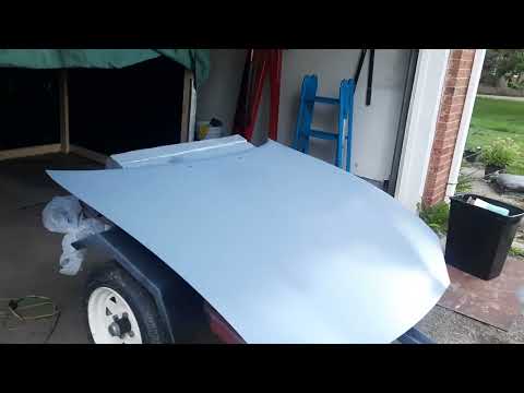 Painting the NB Miata hood outdoors. Step 1, epoxy primer.