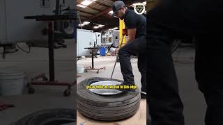 Removing a semi truck tire from the rim.