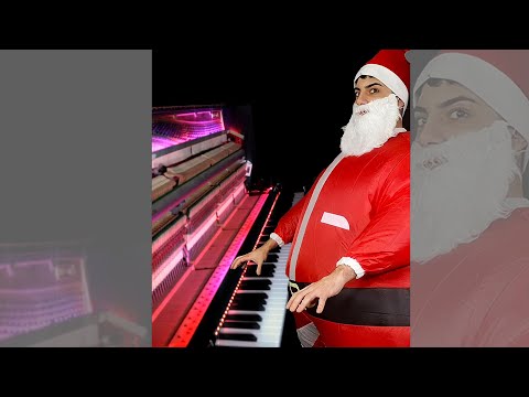 Santa Claus plays Piano with a lot of energy