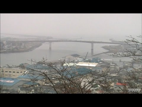 石巻市に押し寄せる津波