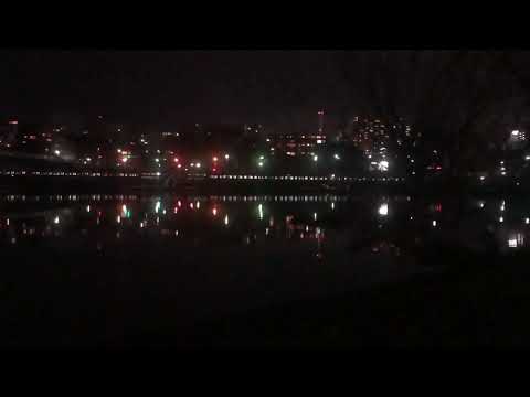 Train Reflected on the Water Surface at Night