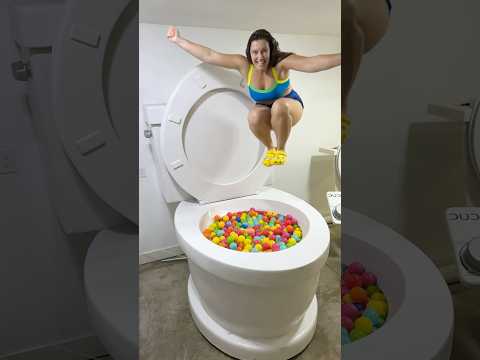 I DUMPED PLAY BALLS into the Worlds Largest Toilet and Did a CANNONBALL JUMP #shorts