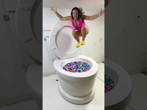 GOING UNDER and JUMPING IN the Worlds Largest Toilet Surprise Egg Pool #shorts