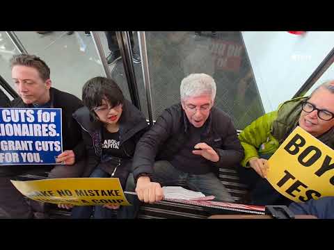 "Zelensky is our hero!" Protesters chant as they block and OCCUPY Tesla Showroom in Manhattan