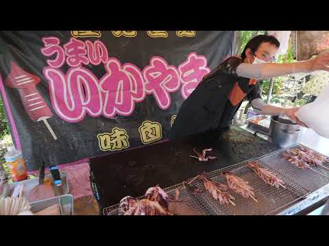 屋台 Amazing Japanese funny stall at wisteria flower festival in Tokyo Japan.